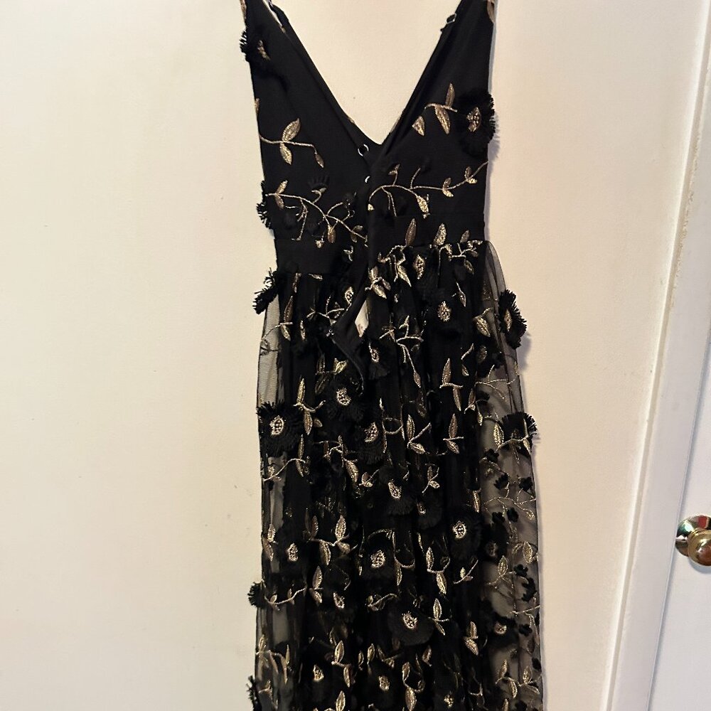 Pretty long black dress with gold leaves